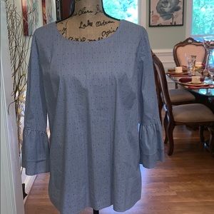 Blue and white striped blouse with bell sleeves.